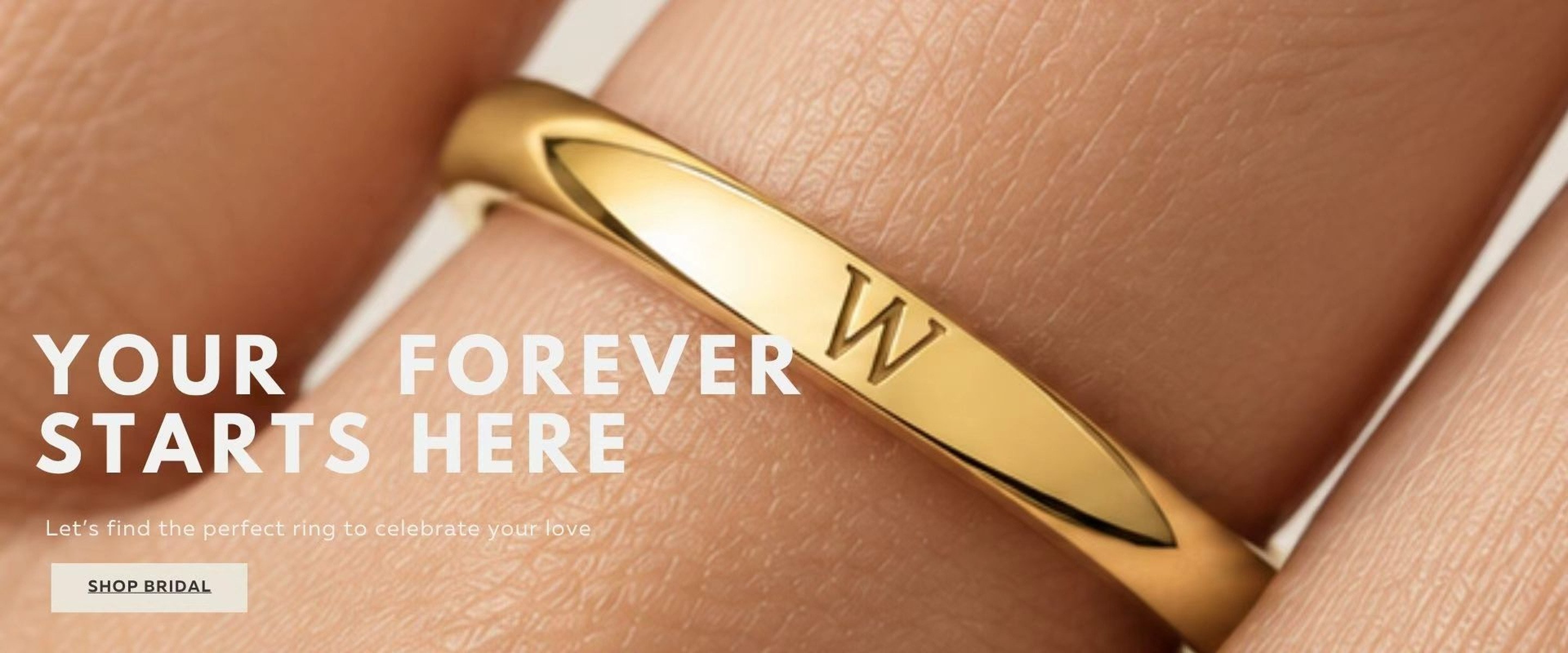 Your forever starts here — a 14K gold wedding band engraved with the initial W. Let's find the perfect ring to celebrate your love.