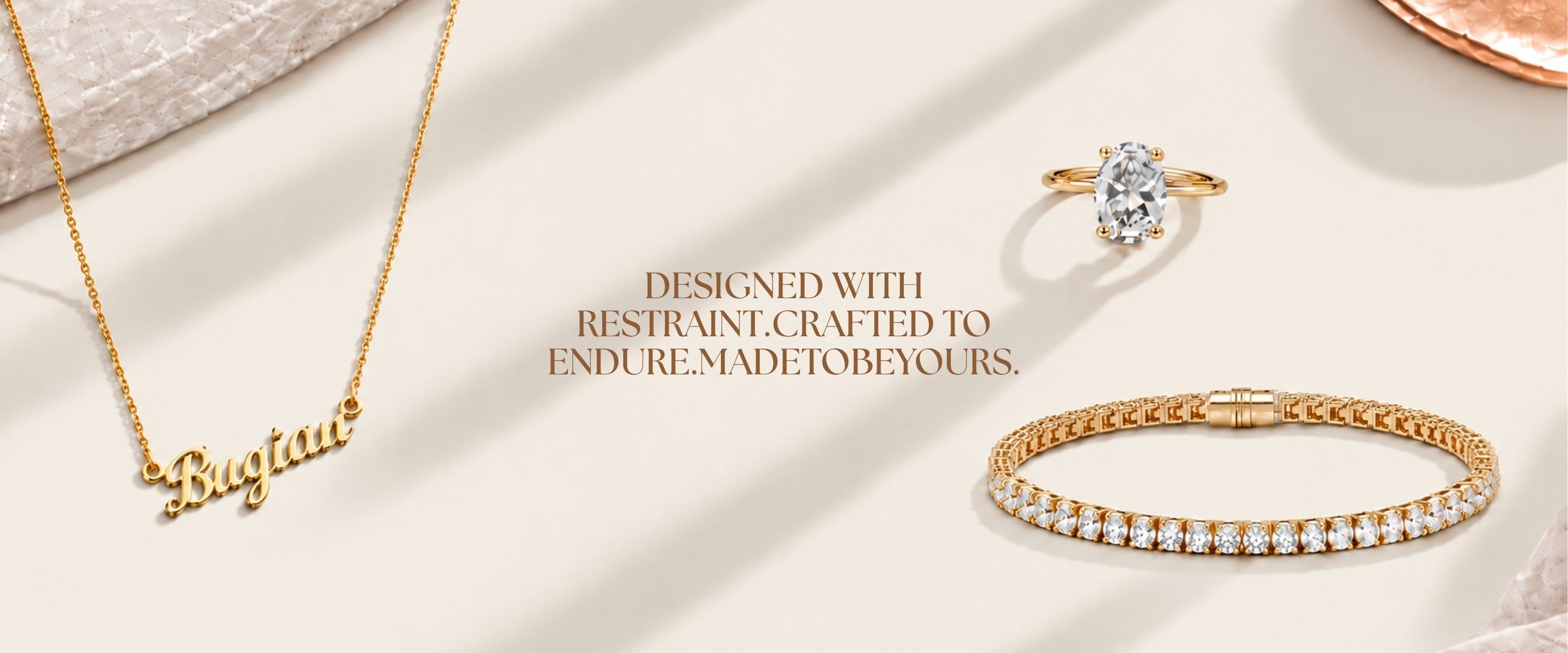 Designed with restraint. Crafted to endure. Made to be yours. — fine jewelry arranged on a warm neutral backdrop