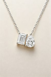 Two-Stone Pendant Necklace, Emerald & Pear Brilliant Cut — 14K White Gold
