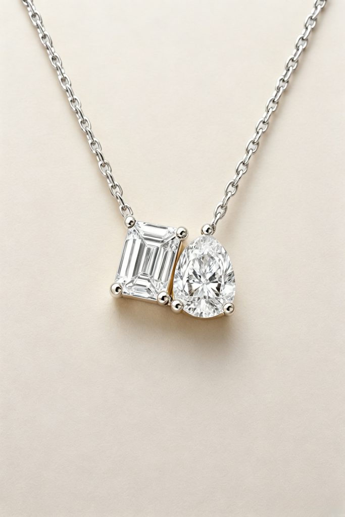 Two-Stone Pendant Necklace, Emerald & Pear Brilliant Cut — 14K White Gold