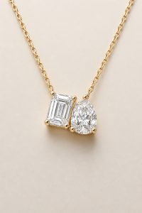 Two-Stone Pendant Necklace, Emerald & Pear Brilliant Cut — 14K Yellow Gold