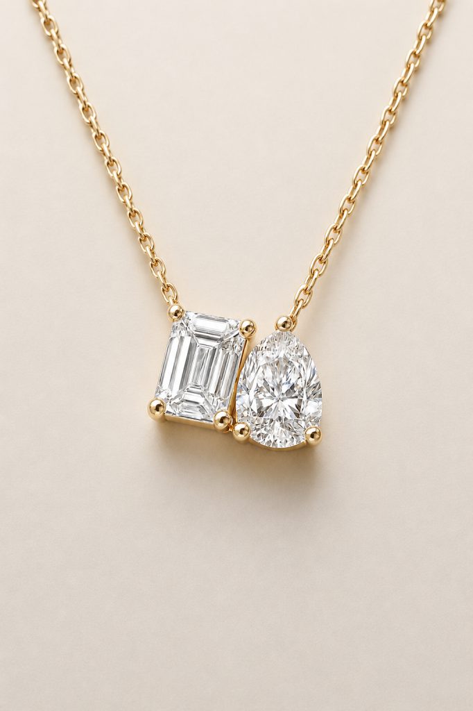 Two-Stone Pendant Necklace, Emerald & Pear Brilliant Cut — 14K Yellow Gold
