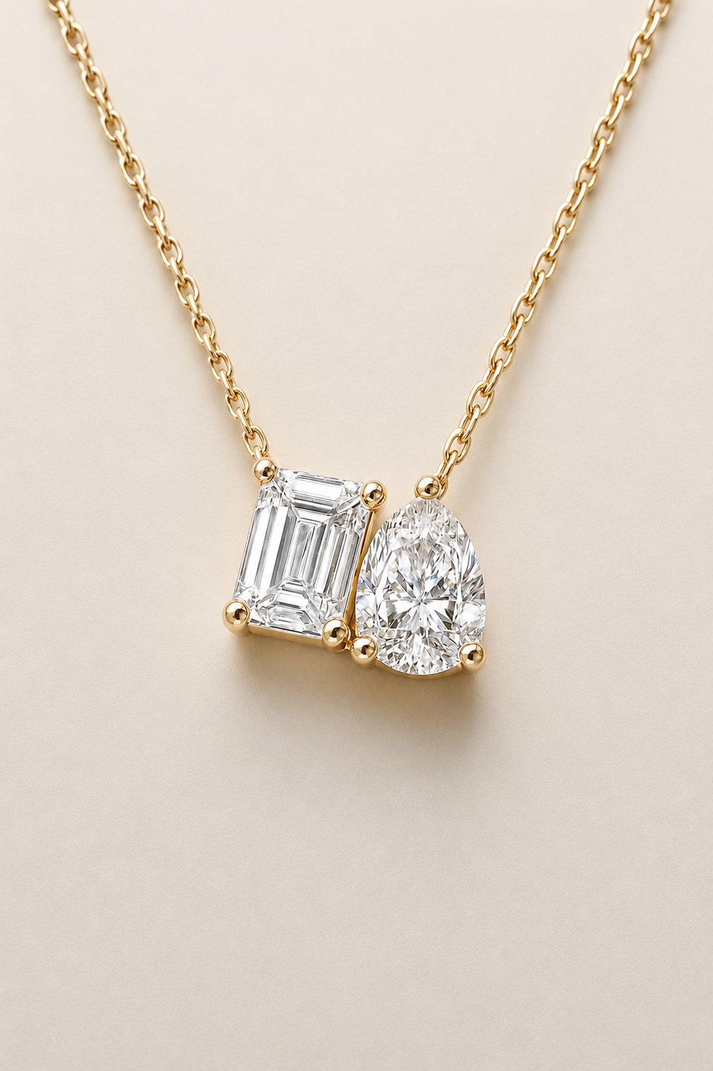 Two-Stone Pendant Necklace, Emerald & Pear Brilliant Cut — 14K Yellow Gold