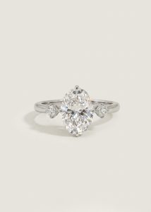 Oval Modified Brilliant Diamond Ring with Heart Side Stones — 3-Stone Engagement