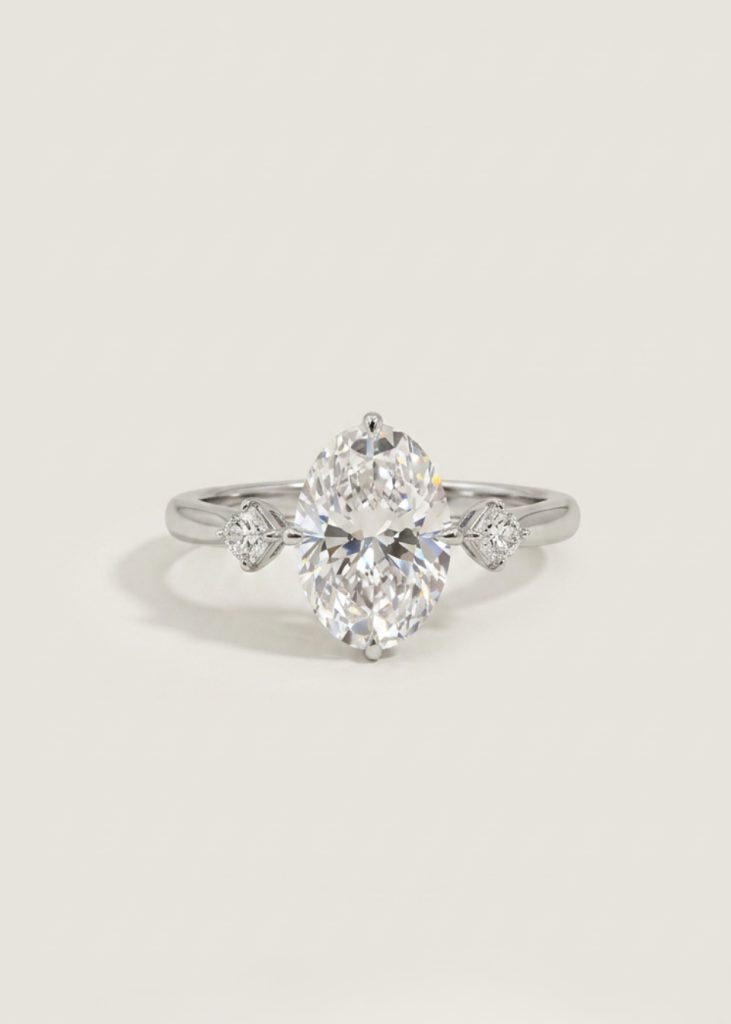Oval Modified Brilliant Diamond Ring with Heart Side Stones — 3-Stone Engagement